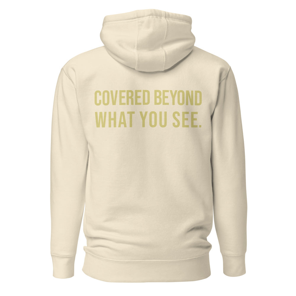Covered Beyond What You See — Bone hoodie back with Butter ink slogan