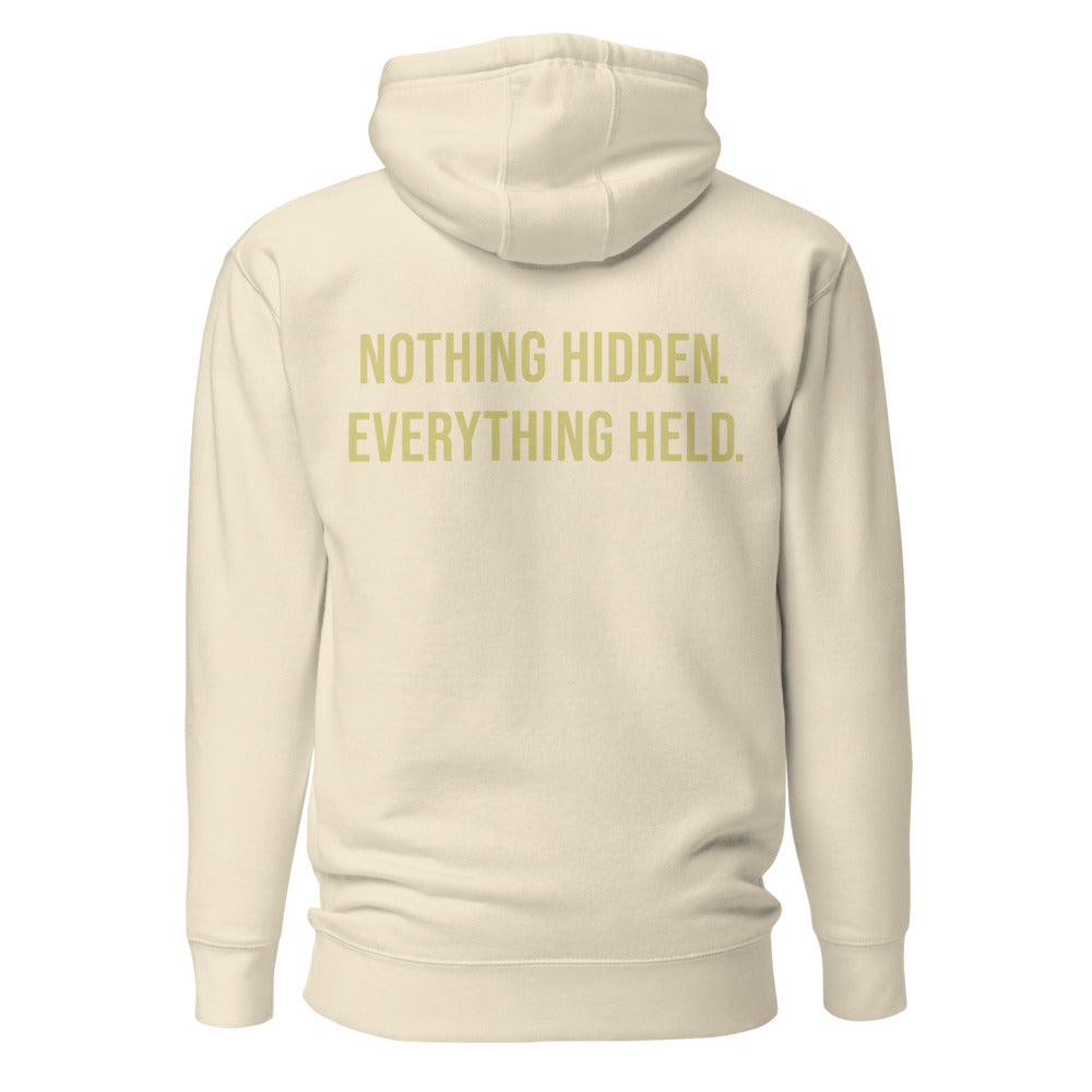Nothing Hidden Everything Held — Bone hoodie back with Butter ink slogan