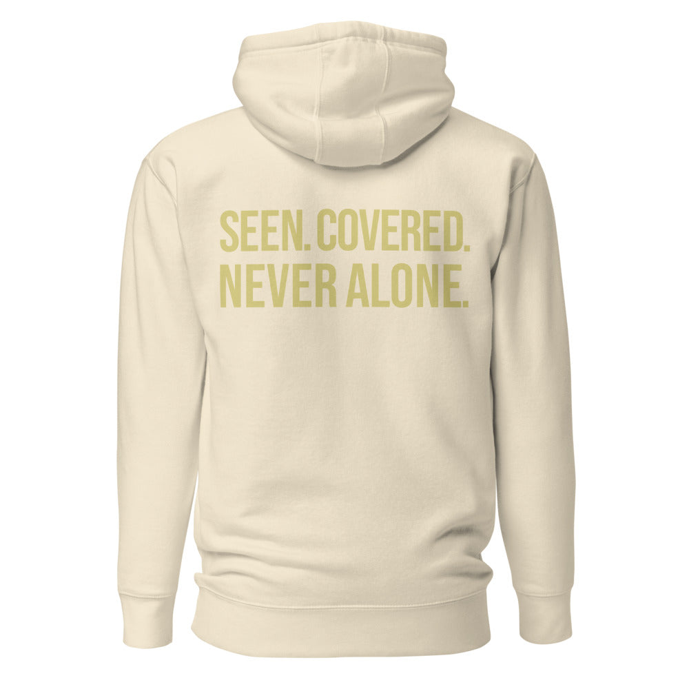 Seen Covered Never Alone — Bone hoodie back with Butter ink slogan