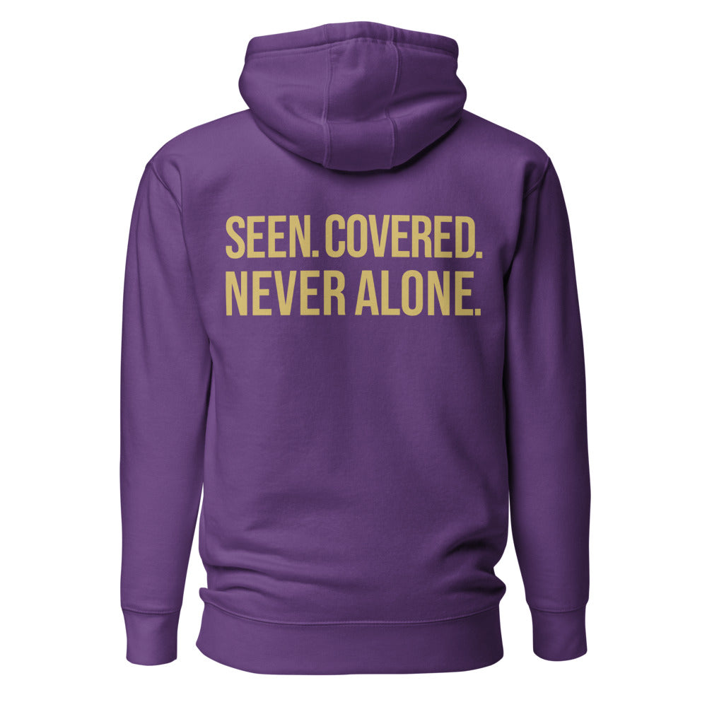 Seen Covered Never Alone — Purple hoodie back with Gold ink slogan